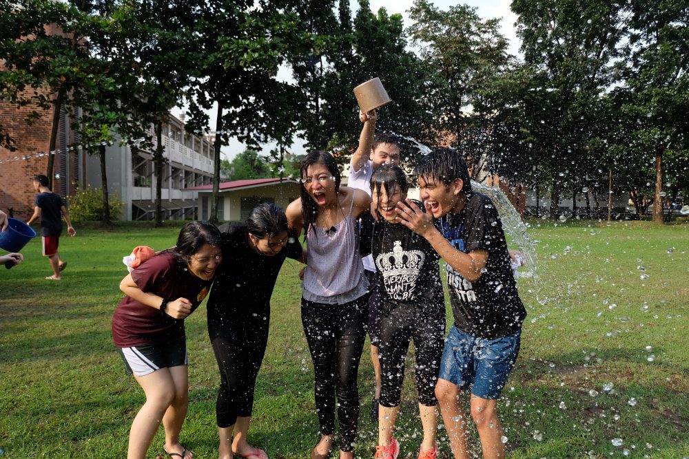 New friends getting splashed in the JuMP Graduation. Photo by Brittney Ong.